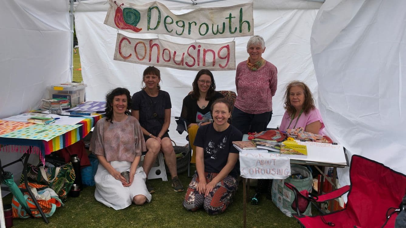 6 Degrowth Ballarat Hub members in a market stall